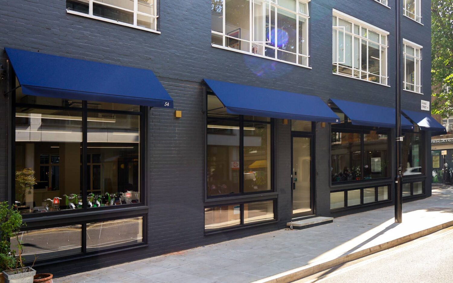 Deans RIB® fixed panel canopy installed at Bourne Office Space, enhancing the building’s façade